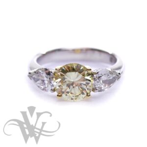 NATURAL FANCY YELLOW ROUND DIAMOND WITH 2 PEAR SHAPED DIAMONDS #3193